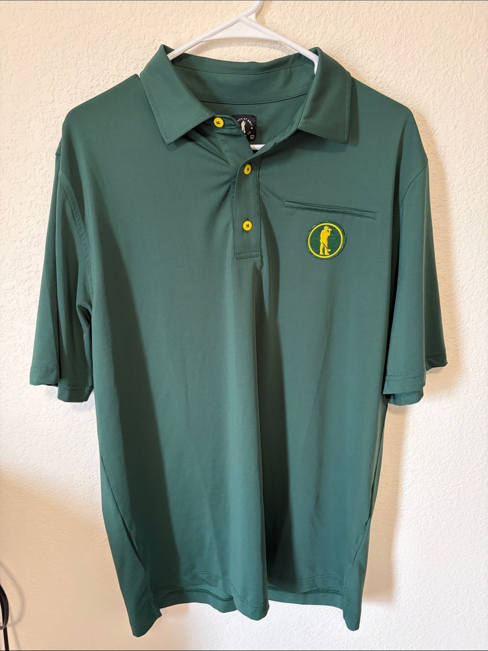 U Suck at Golf Men's Green Polo with patch